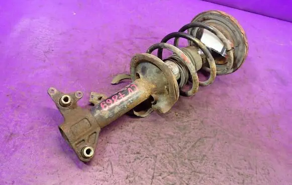Nissan Primera Front shock absorber with coil spring