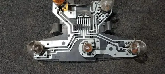 Tail light bulb cover holder