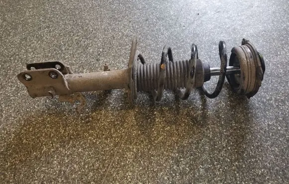 Nissan Juke I F15 Front shock absorber with coil spring