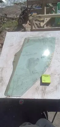 Mazda 626 Front door window glass four-door 1212123