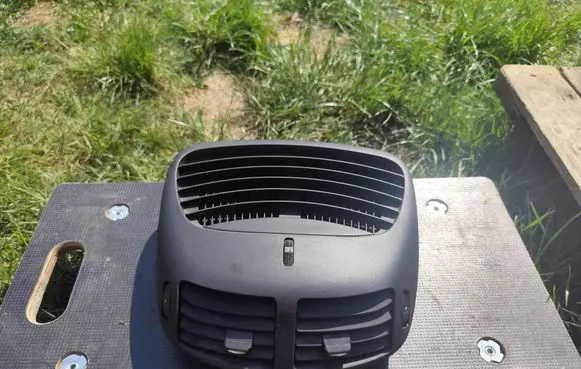 Dash center air vent grill