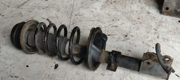 Suzuki Swift I Front shock absorber with coil spring 4160262J32