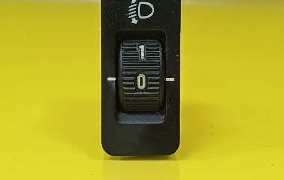 Headlight level height control switch