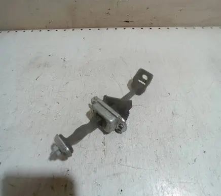 Front door check strap stopper