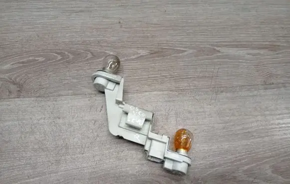 Volvo V50 Tail light bulb cover holder