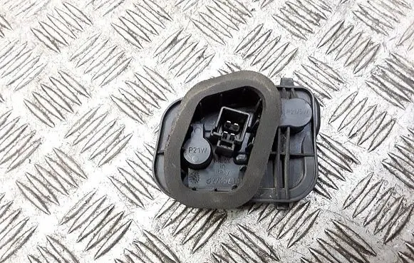 Tail light bulb cover holder