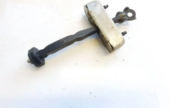 Front door check strap stopper
