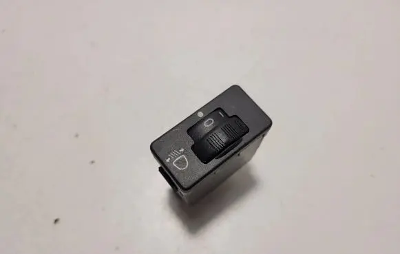 Headlight level height control switch