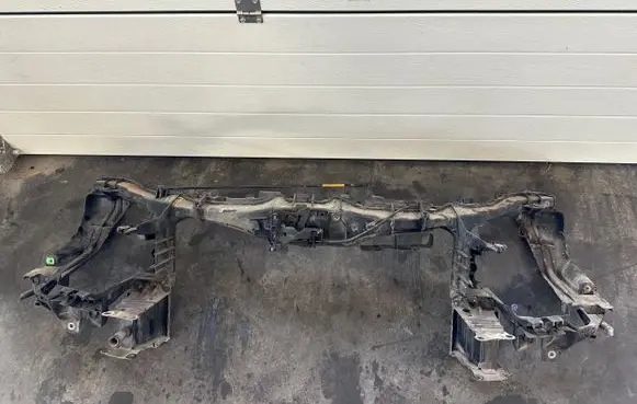 Radiator support slam panel