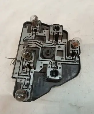 Tail light bulb cover holder