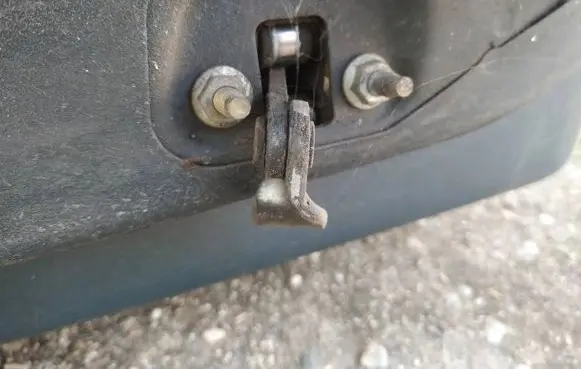 Front door check strap stopper