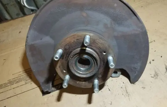 Front wheel hub spindle knuckle