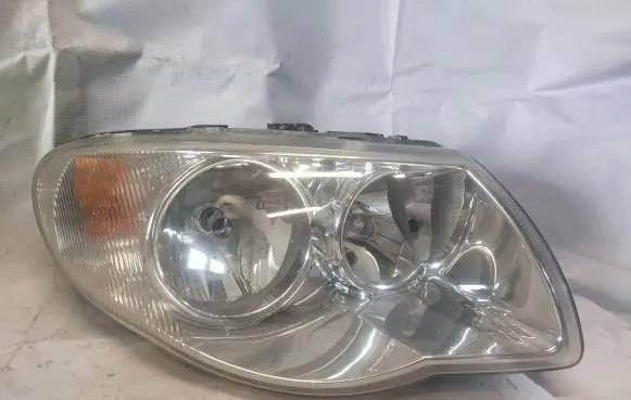 Chrysler Voyager Headlight/headlamp 04857830AB