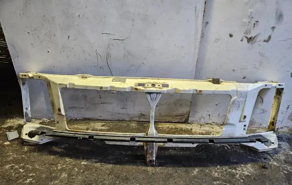 Top upper radiator support slam panel