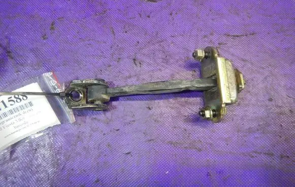 Front door check strap stopper