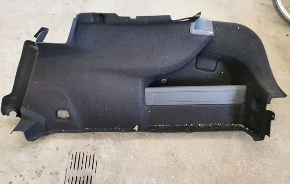 Trunk/boot lower side trim panel