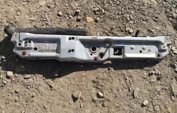 Top upper radiator support slam panel