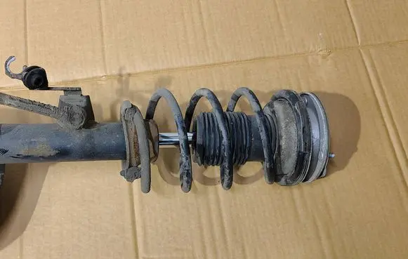 Front shock absorber with coil spring