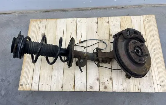 Front shock absorber with coil spring