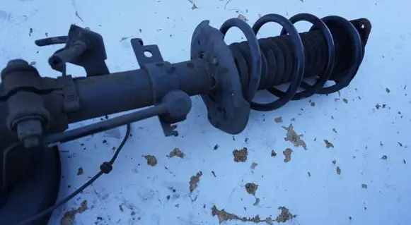 Front shock absorber with coil spring