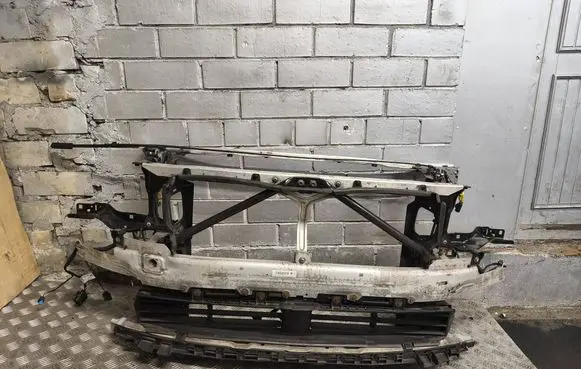 Radiator support slam panel