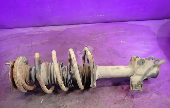 Nissan Almera Tino Front shock absorber with coil spring