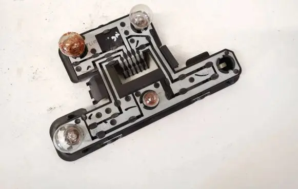 Tail light bulb cover holder