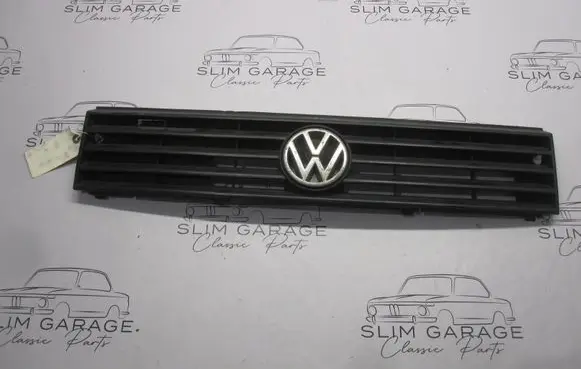 Volkswagen Polo II 86C 2F Front bumper upper radiator grill 867853653G