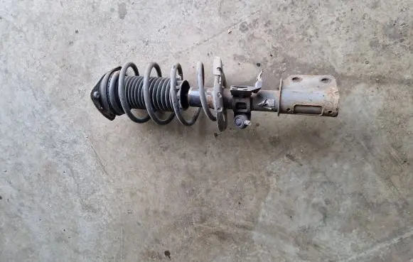 Front shock absorber with coil spring