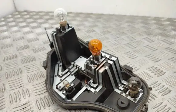 Tail light bulb cover holder