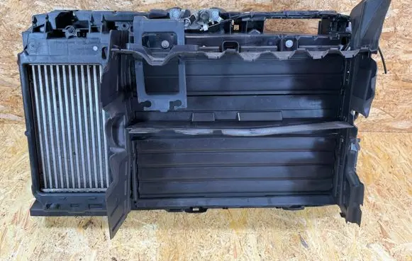 Radiator support slam panel