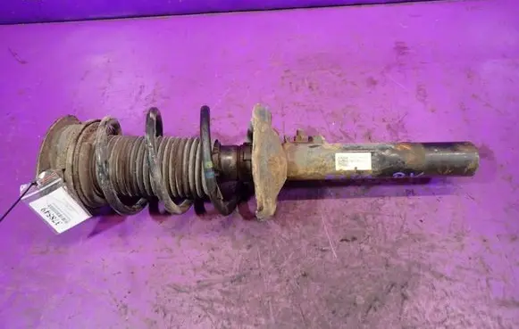 Volkswagen Golf VII Front shock absorber with coil spring 5Q0413023FJ