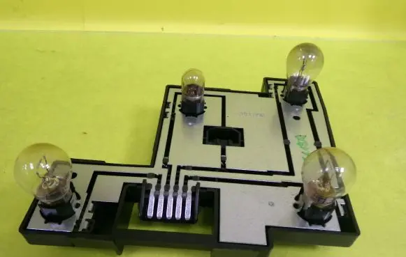 Tail light bulb cover holder