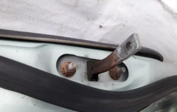 Mazda 323 F Rear door check strap stopper
