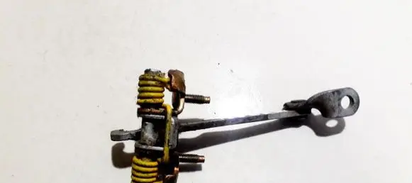 Front door check strap stopper