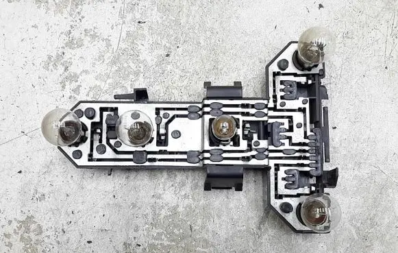 Tail light bulb cover holder
