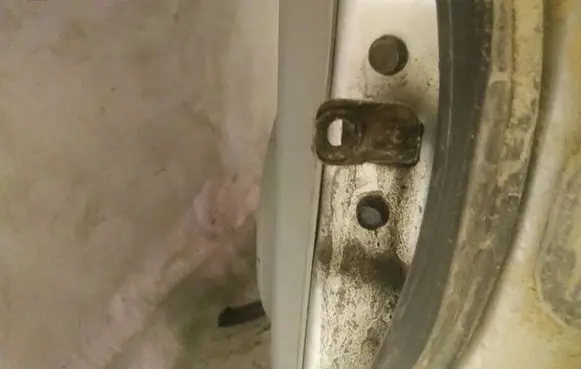 Rear door check strap stopper