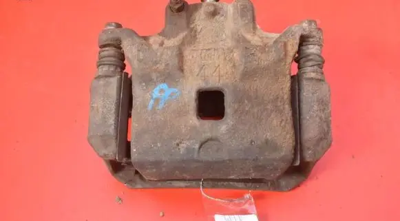 Nissan Juke I F15 Front brake caliper