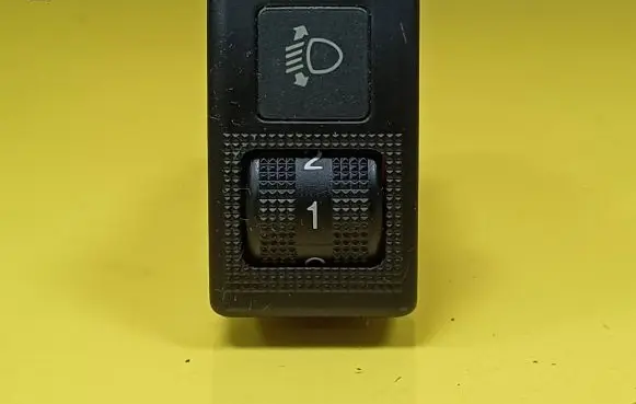 Headlight level height control switch