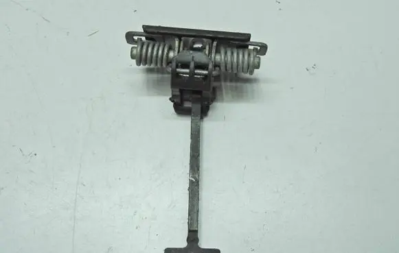 Front door check strap stopper