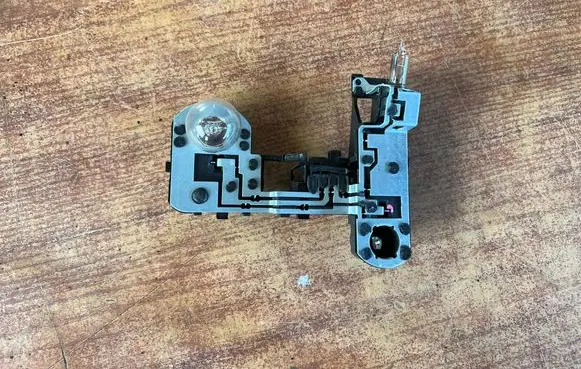 Tail light bulb cover holder