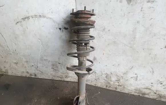 Toyota Yaris Front shock absorber with coil spring