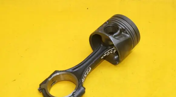 Piston with connecting rod