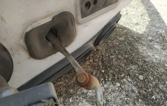 Front door check strap stopper