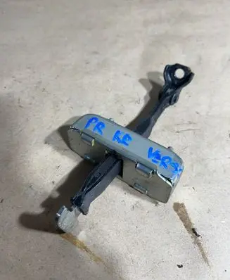 Front door check strap stopper