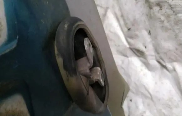 Front door check strap stopper