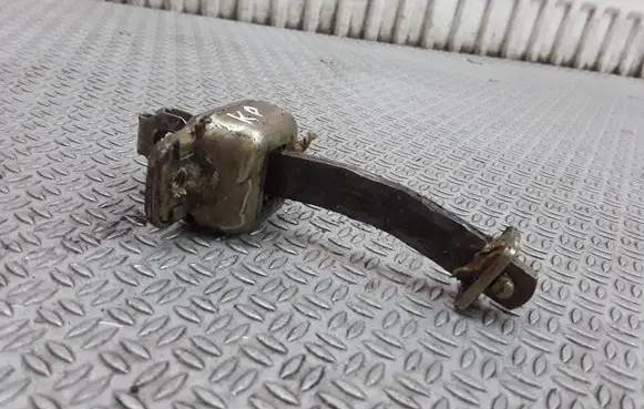 Front door check strap stopper