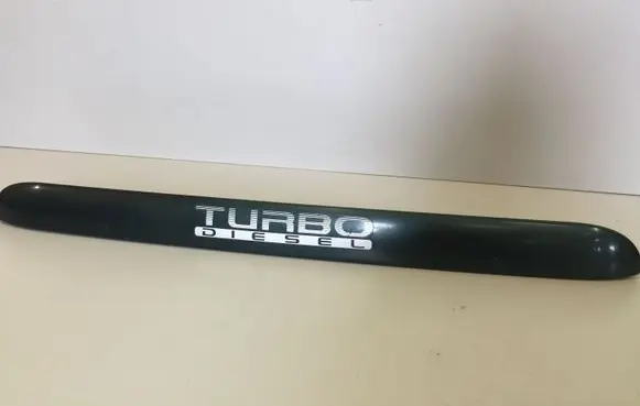 Trunk door license plate light bar
