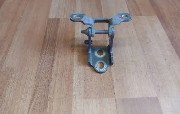 Rear door upper hinge