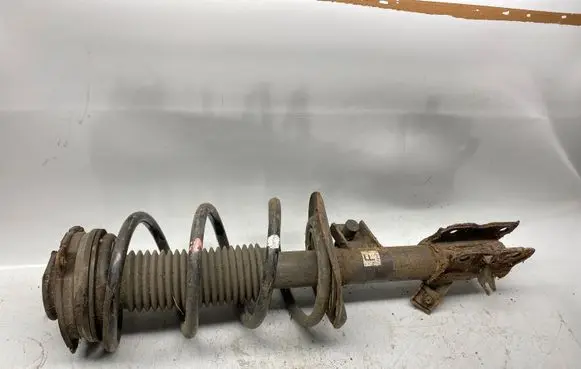 Nissan X-Trail T31 Front shock absorber with coil spring